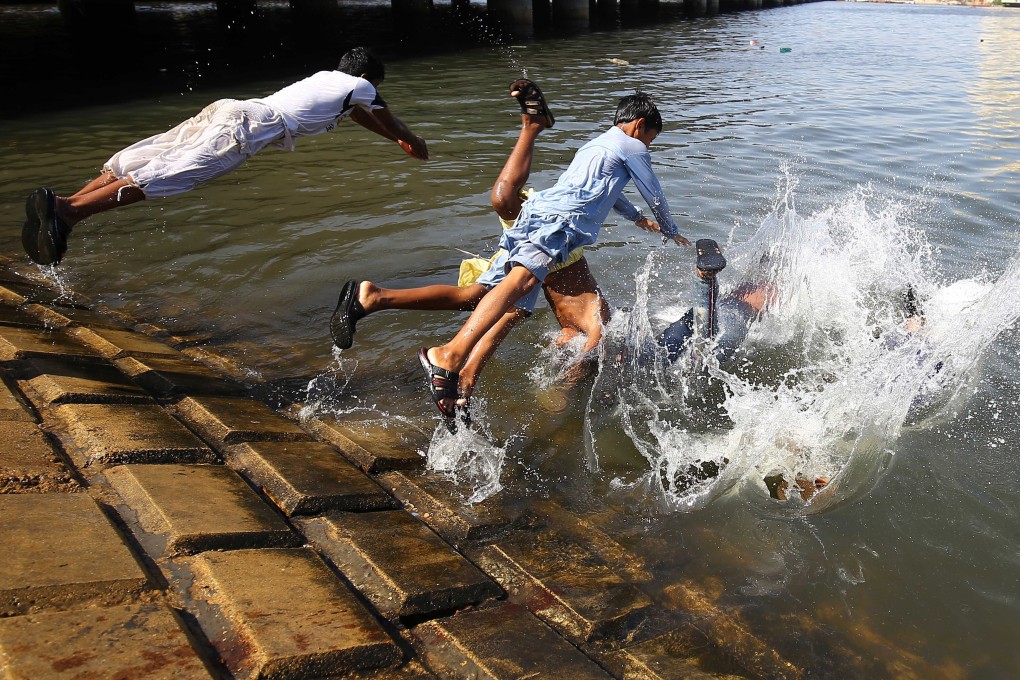 Children swim to beat the heat during the Muslim holy month of Ramadan in Sindh province, Pakistan. Photo: EPA