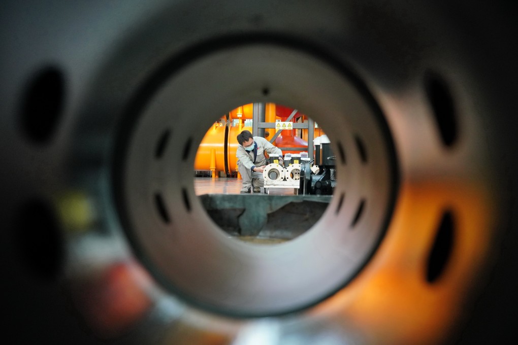 A worker wearing a mask amid the coronavirus pandemic is pictured in a factory in Hebei province, North China. Photo: Xinhua