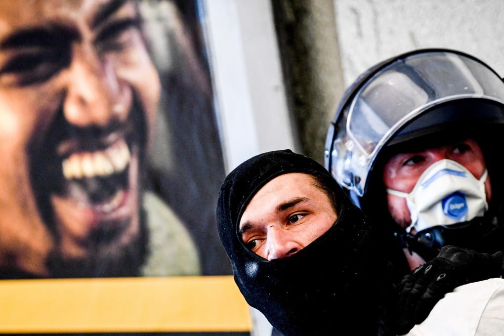 Police arrest a right-wing protester in Berlin on Saturday. Photo: EPA