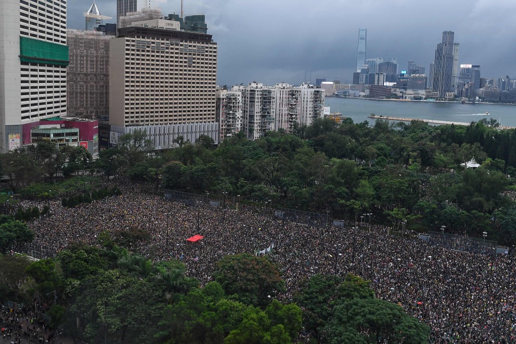 Protesters gather for a peaceful rally in Victoria Park on August 18, 2019. Photo: AFP