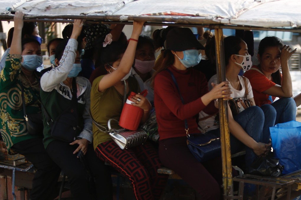 Cambodian garment workers travel home from work in Phnom Penh, where factory pay has fallen to US$30 month, which is not a living wage, and factories employing 100,000 workers have reportedly suspended operations since January. Photo: EPA-EFE