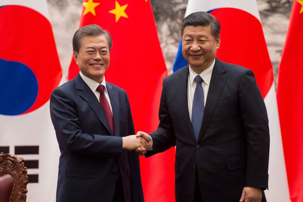 Chinese President Xi Jinping (right) and South Korean President Moon Jae-in have agreed to boost cooperation. Photo: AFP