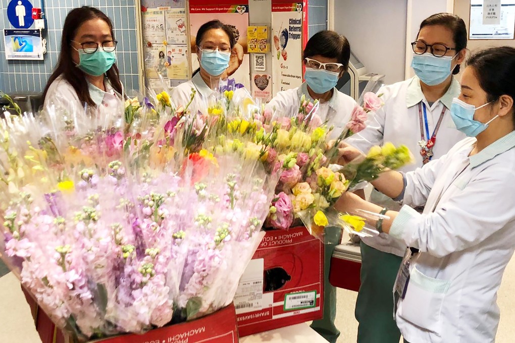 Nurses and other medical staff at a public hospital receive flowers from the Hong Kong Community Foundation on International Women’s Day. Four hospitals with the most coronavirus cases received 2,000 flowers in all, as a mark of appreciation to medical professionals fighting the outbreak. Photo: Handout