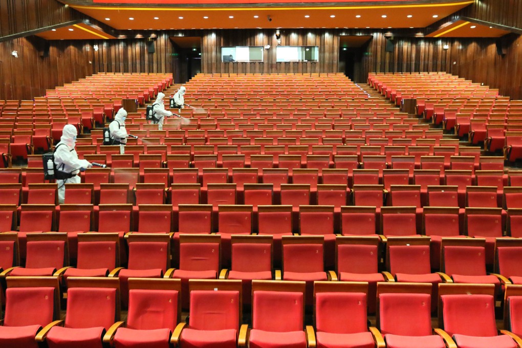 Workers disinfect the seats at the Yantai Grande Theatre to prevent the spread of novel coronavirus in Yantai, Shandong province, as the country prepares to gradually reopen entertainment venues. Photo: VCG/Visual People