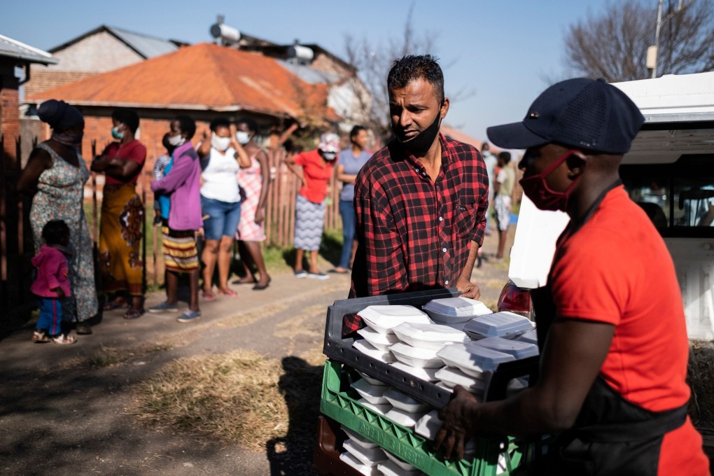 Members of a local charity deliver food in the Johannesburg suburb of Vrededorp on Tuesday, as South Africa and many other African countries start feeling the impact of the coronavirus pandemic. Photo: AFP
