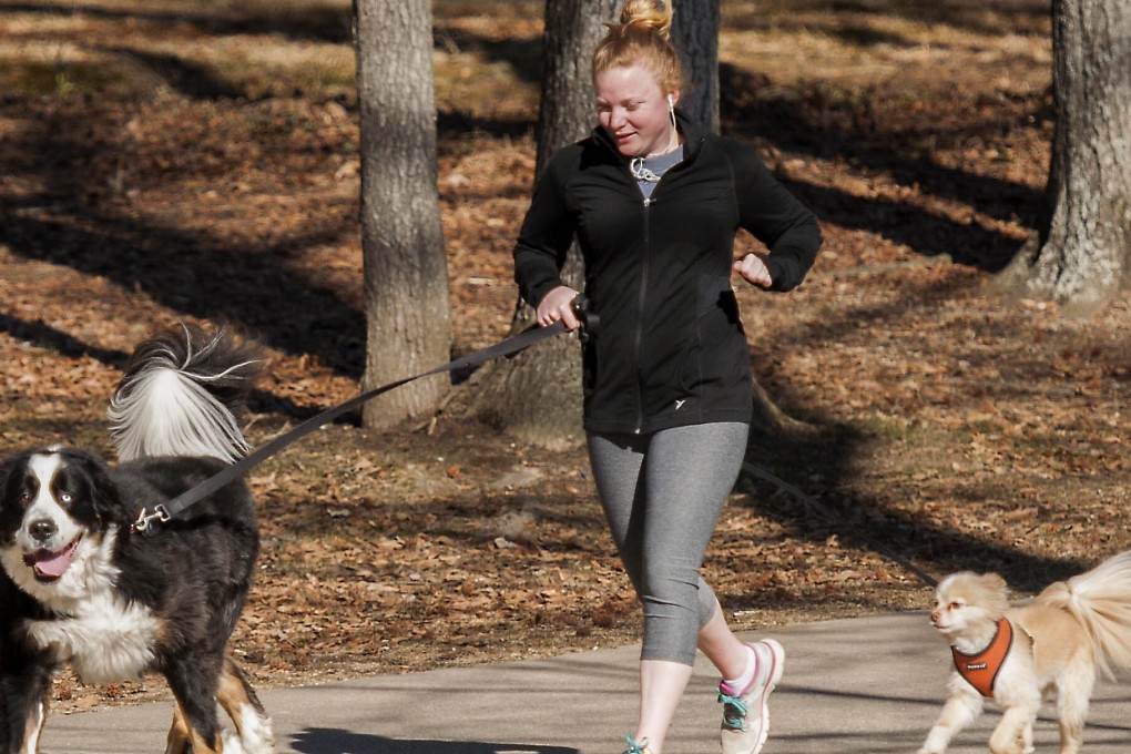 When you are exercising in summer heat, make sure you take precautions to prevent you or your dogs from suffering heat exhaustion or heatstroke. Photo: flickr Editorial/Getty Images