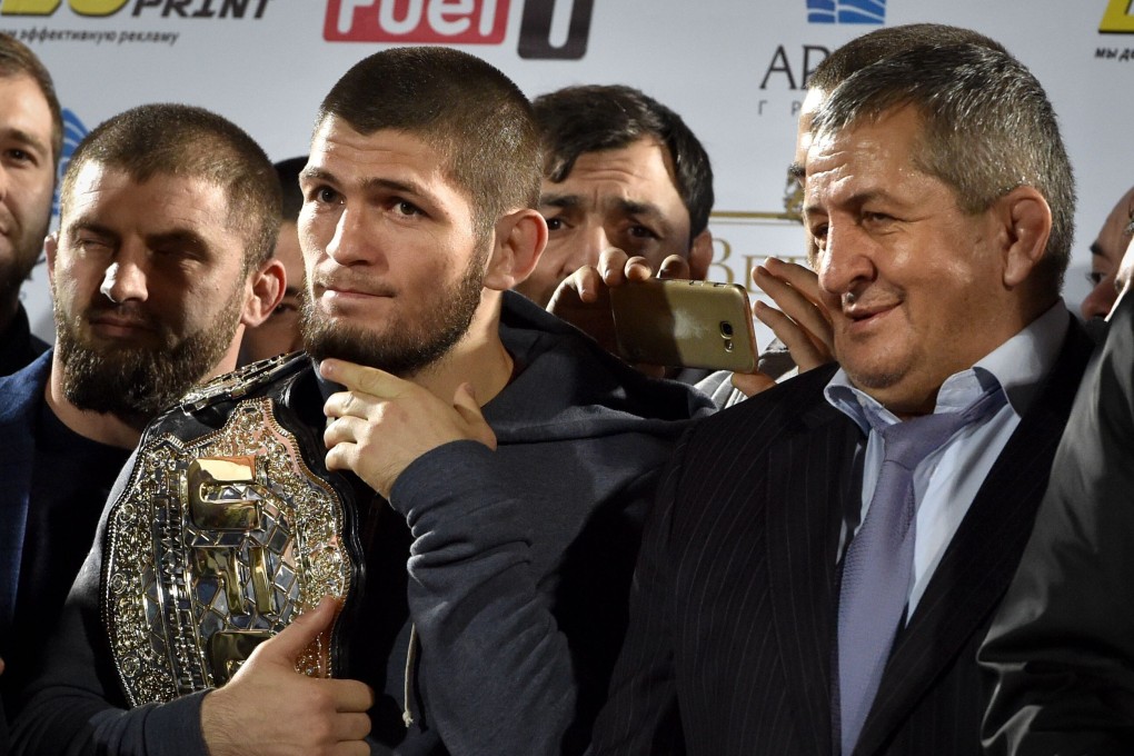 UFC lightweight champion Khabib Nurmagomedov with his father Abdulmanap during a ceremony upon their return to Russia after his win against Conor McGregor. Photo: AFP