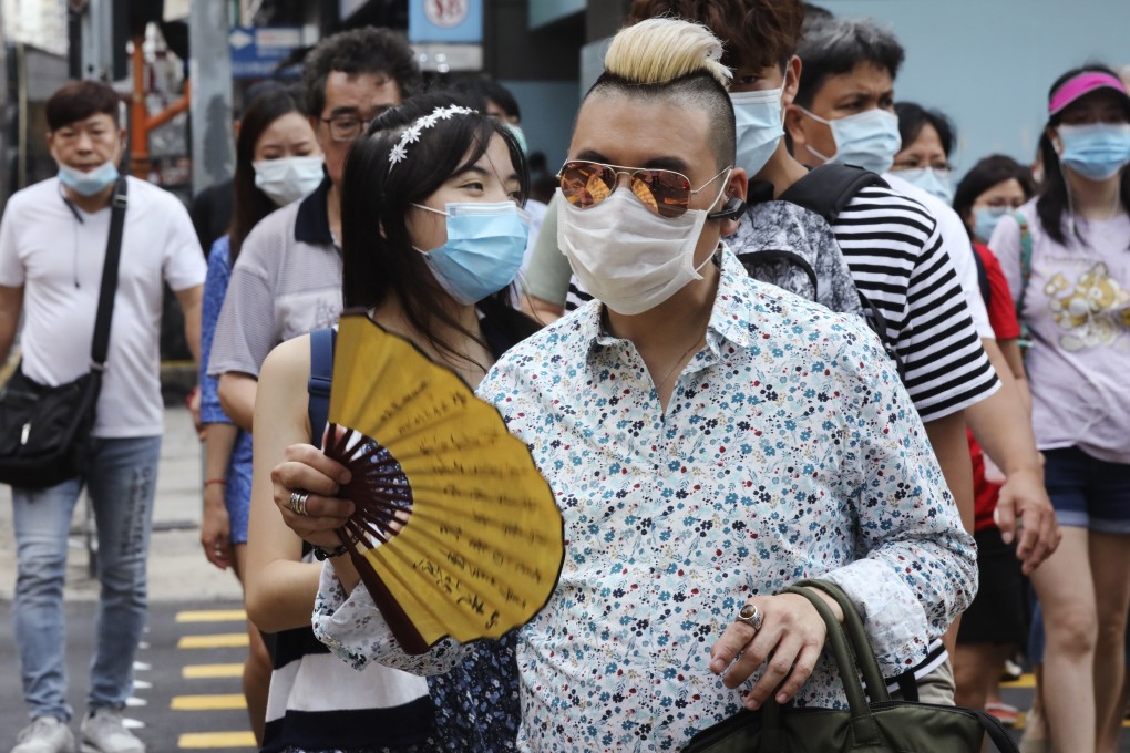 People crowd Mong Kok on Sunday as the social distancing measures against coronavirus relax. Photo: K.Y. Cheng