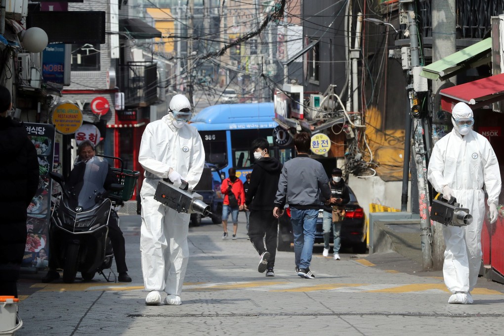 Quarantine workers disinfect night spots in Itaewon, Seoul. Photo: Reuters