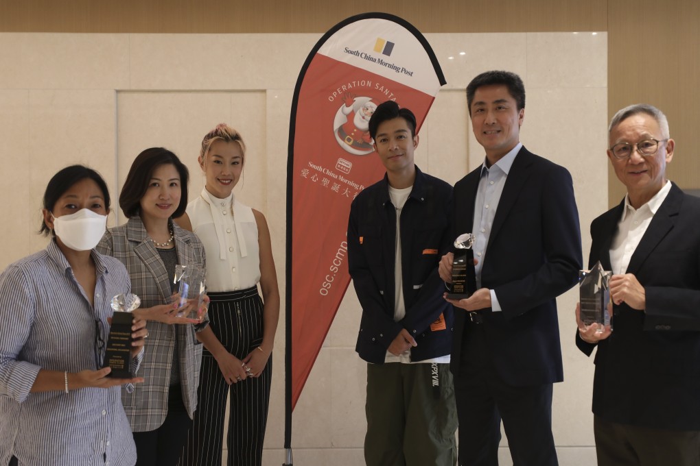 (From left) Kabeeta Gurung, of the Discovery Mind International Play Centre; Angela Yip, of Shung Tak Catholic English College’s Parent Teacher Association; Olympic swimmer and Operation Santa Claus (OSC) ambassador Stephanie Au; Canto-pop singer Chau Pak-ho; Morgan Stanley community affairs chief Kwok-Choi Wong and Dr Joseph Chan attend the May 13 OSC award ceremony in Shau Kei Wan. Photo: Xiaomei Chen