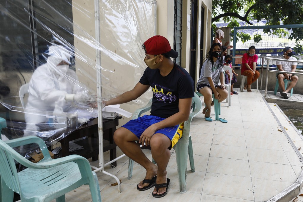 Covid-19 testing in Mandaluyong City, Metro Manila. Photo: EPA