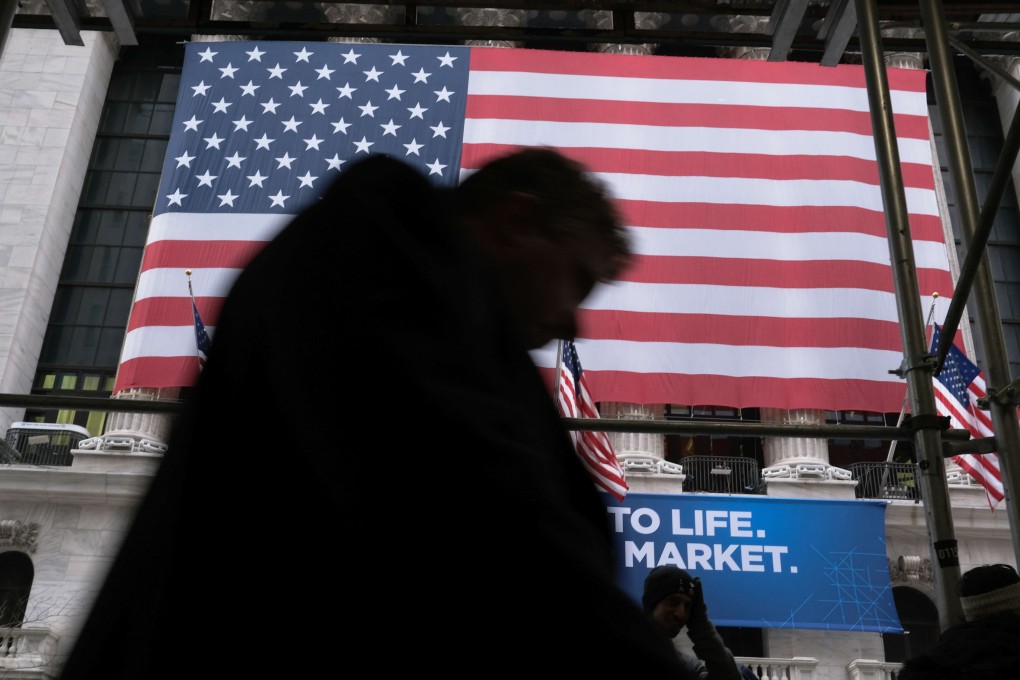 A figure passes the New York Stock Exchange. Photo: AFP