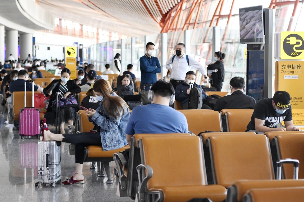 Passengers at a boarding area for domestic flights at the Beijing Capital International Airport on May 10, 2020. Photo: Kyodo