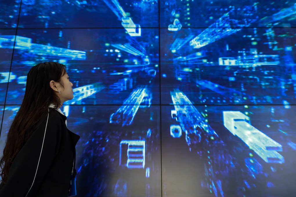 A staff member passes a display at China’s Telecom’s cloud computing facility in Guian New Area, in the southwestern province of Guizhou – the country’s designated big data hub. Photo: Xinhua