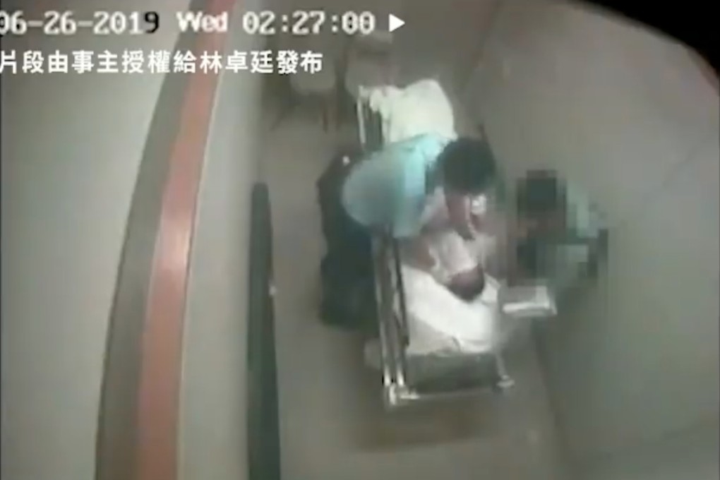 A still from an eight-minute clip showing Chung Chi-wah being beaten by two police officers while he was in hospital last year. Photo: Handout