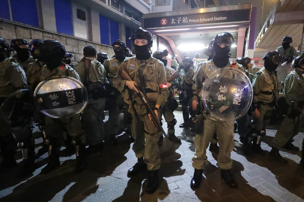 Anti-riot police outside of the Prince Edward MTR station as anti-government protesters gather around the station. Photo: Edmond So