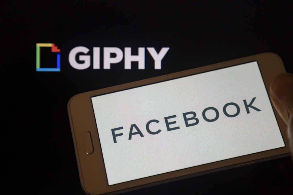 The Logo of Facebook is seen displayed on a smartphone in front of the Giphy logo. Photo: dpa