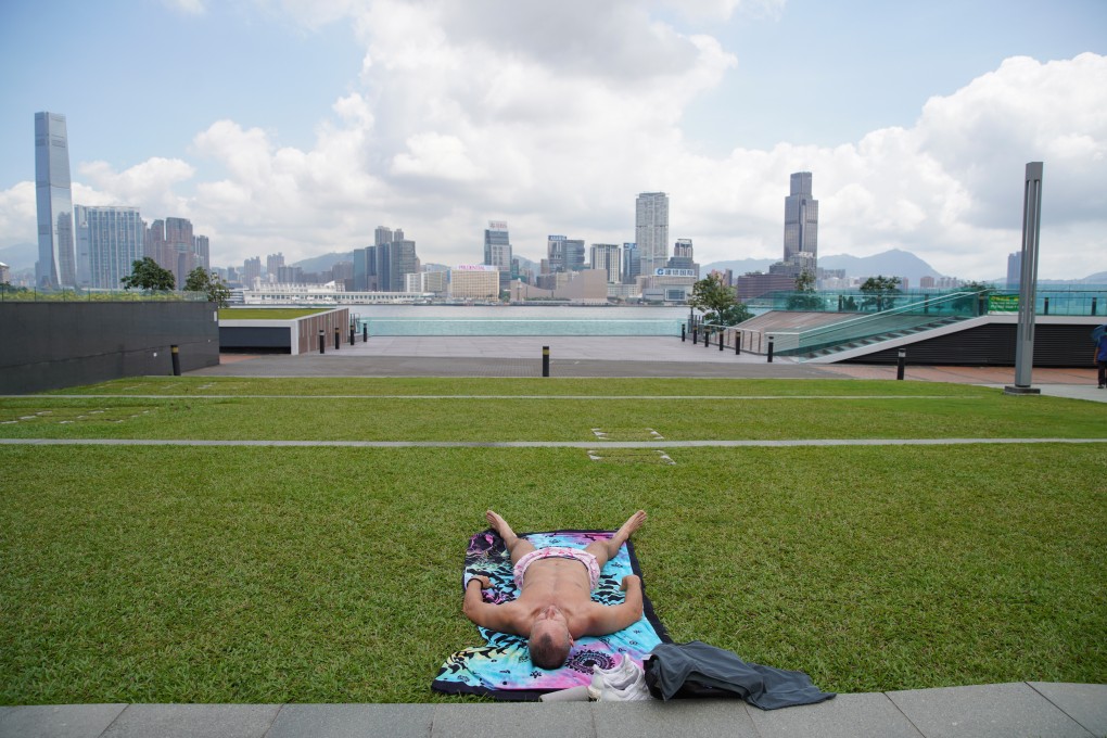 A resident of the city enjoys sunny weather at Tamar Park on May 16. Photo: Winson Wong
