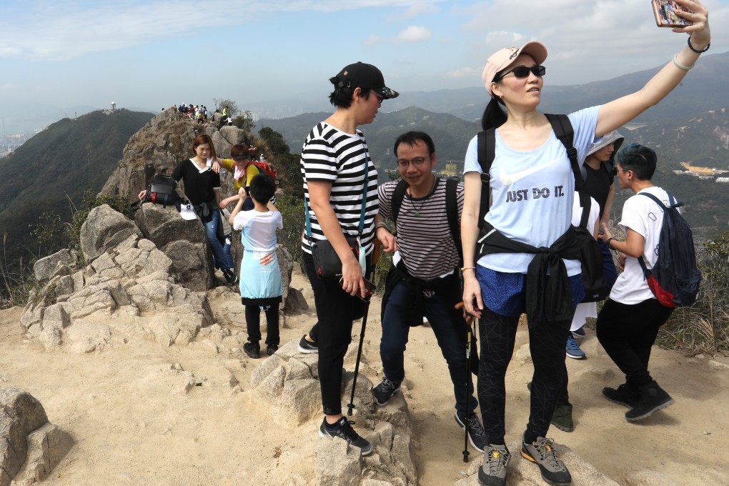 A hiker poses for a selfie at Lion Rock Country Park in Sha Tin. Photo: Dickson Lee