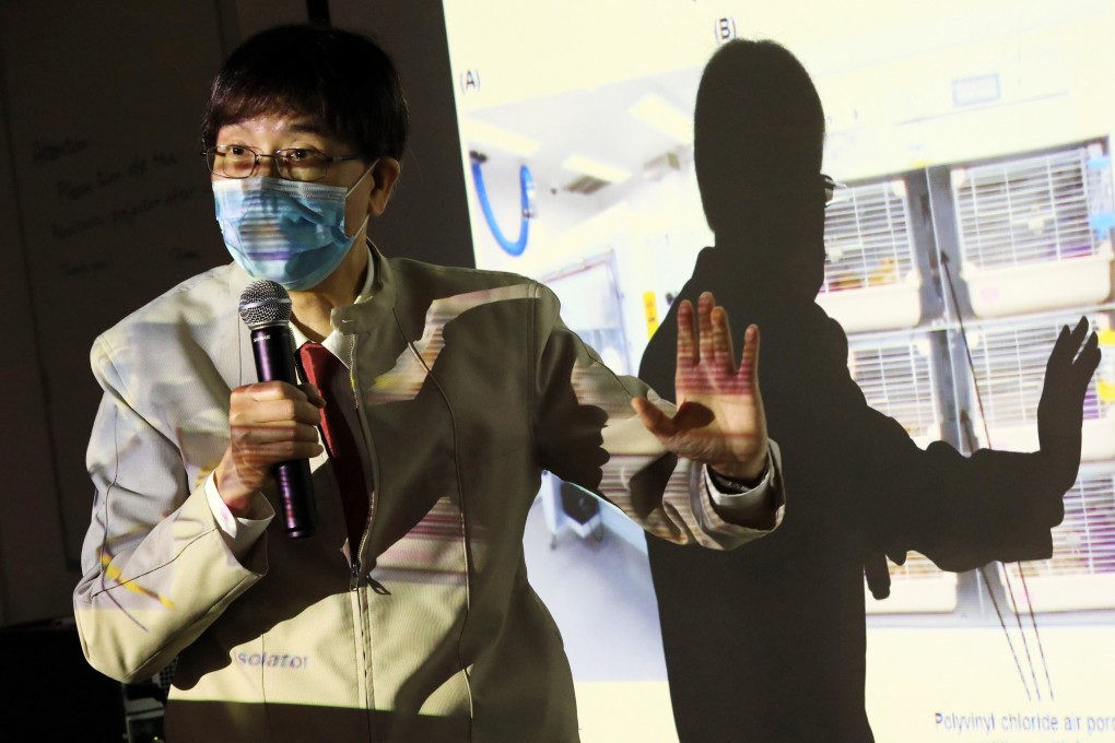 Professor Yuen Kwok-yung of Hong Kong University discusses how surgical mask partitions effectively reduced the transmission of the coronavirus between hamsters on Sunday. Photo: May Tse