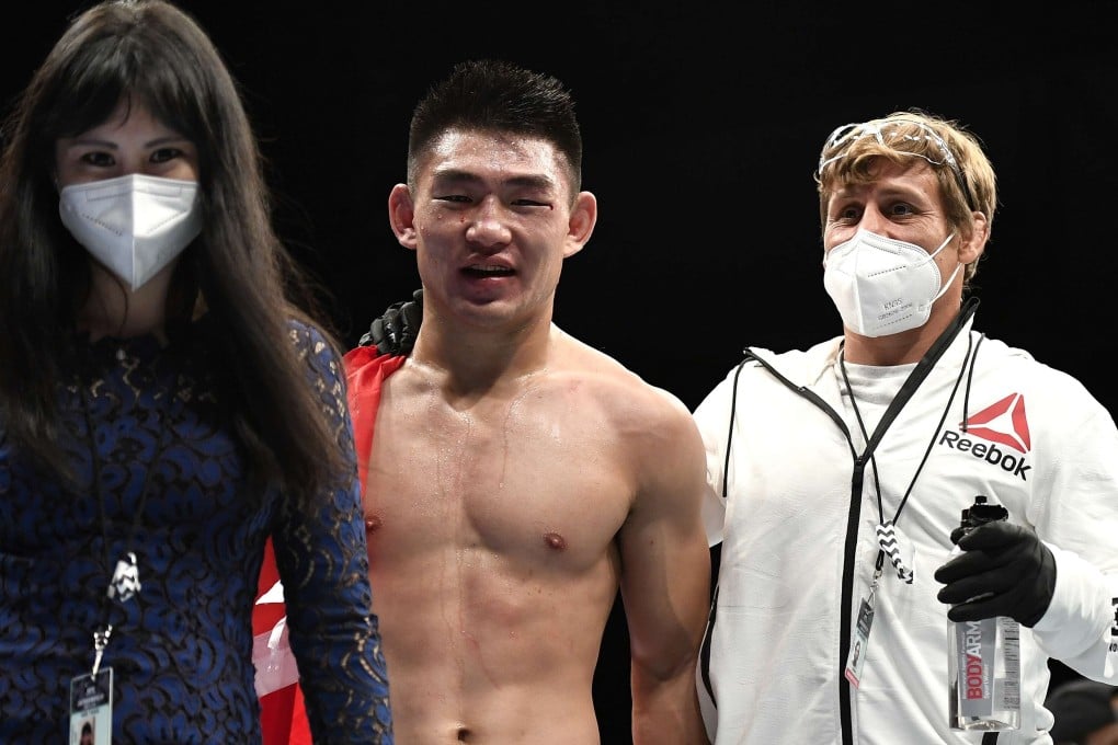 Song Yadong celebrates with coach Urijah Faber after defeating Marlon Vera at UFC on ESPN 8. Photo: AFP