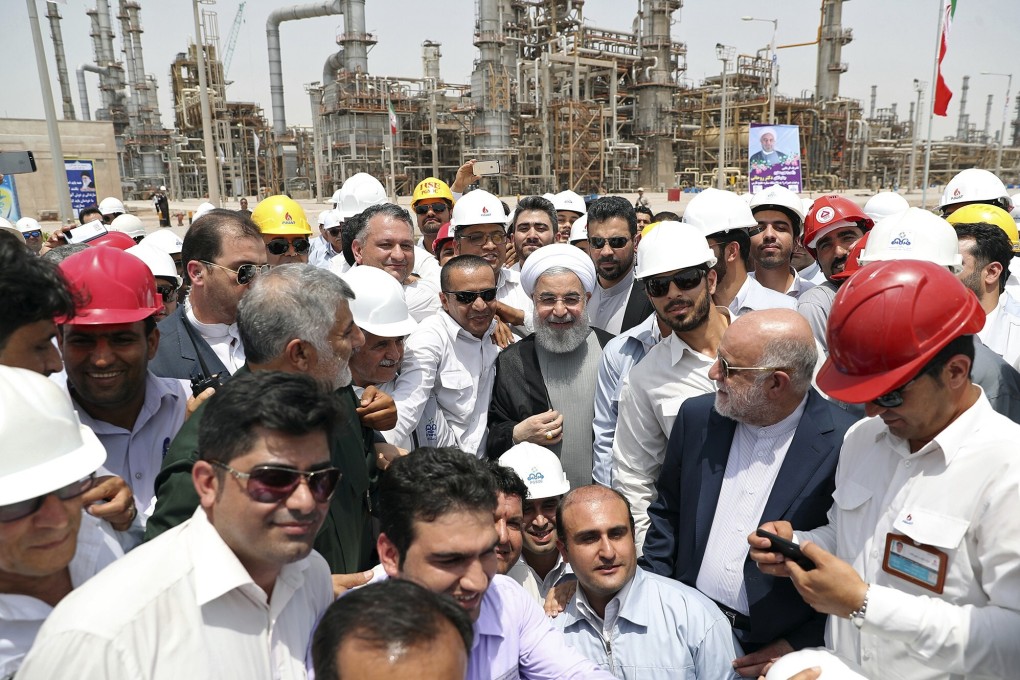 Iranian President Hassan Rowhani, centre, inaugurates the Persian Gulf Star Refinery in Bandar Abbas, Iran. Photo: Iranian Presidency Office via AP