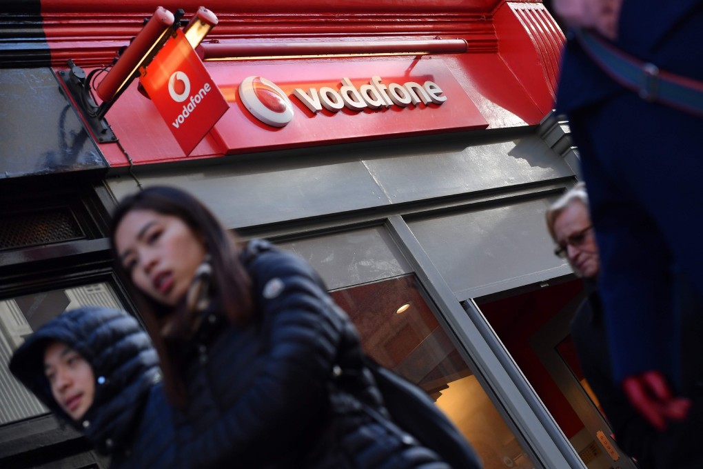 The logo of British mobile phone giant Vodafone is seen on a retail shop in central London. Photo: AFP