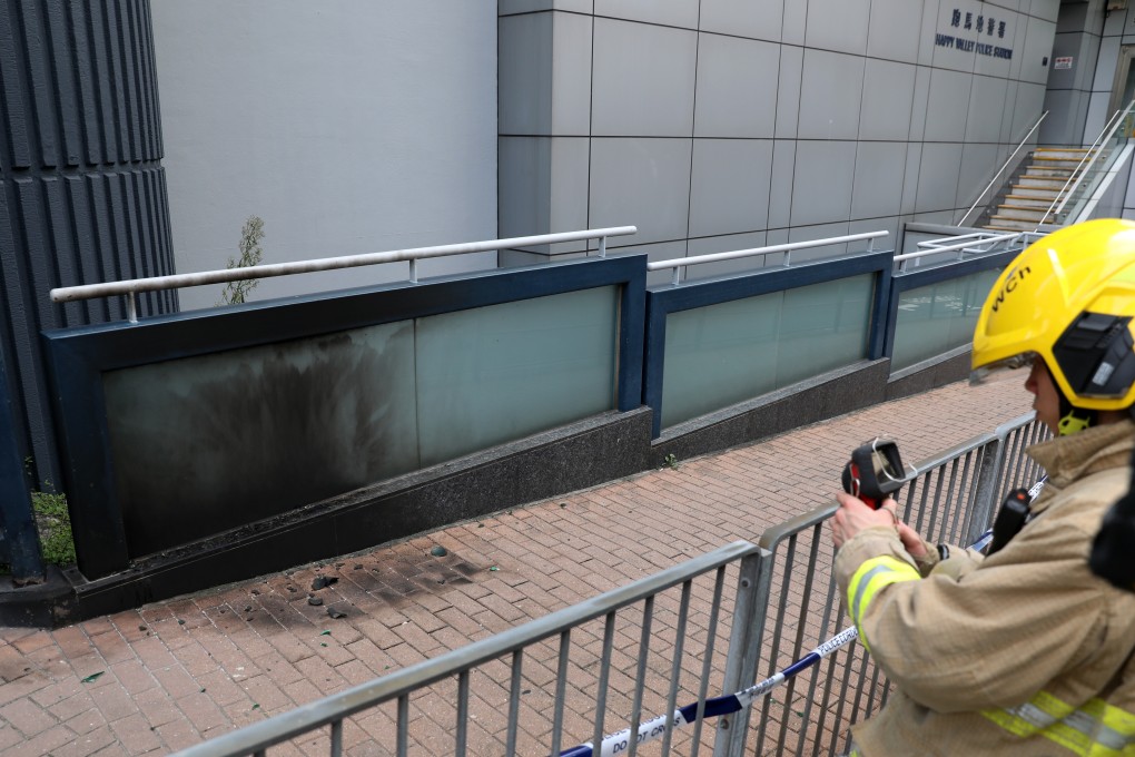 A firefighter at the scene of the second petrol bomb attack at Happy Valley Police Station. Photo: Nora Tam