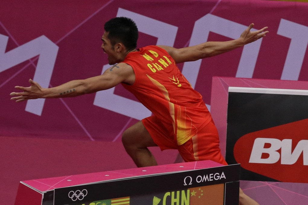 Lin Dan runs past the scoreboard and away from the court while celebrating his victory against Lee Chong Wei in the men's singles final at the 2012 London Olympic Games. Photo: AP