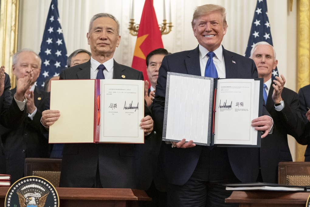 Chinese Vice-Premier Liu He and US President Donald Trump signed the phase one trade deal at the White House in January. Photo: DPA