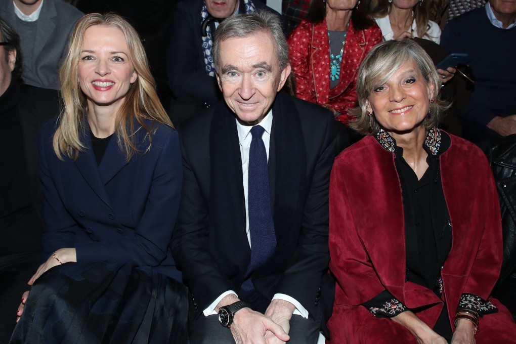 LVMH owner Bernard Arnault, his wife, Helene (right), and Louis Vuitton executive vice-president Delphine Arnault attend the Dior show at Paris Fashion Week in February. Photo: Getty Images