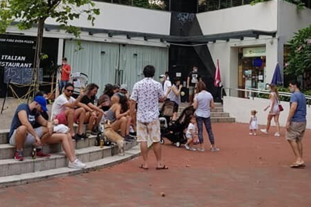 A group of people pictured congregating in the Robertson Quay area of Singapore on Saturday in defiance of social distancing rules. Photo: Facebook