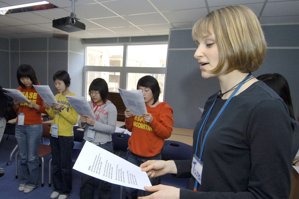 South Korean students take part in an English class with their foreign teacher in Paju, north of Seoul. Photo: AFP
