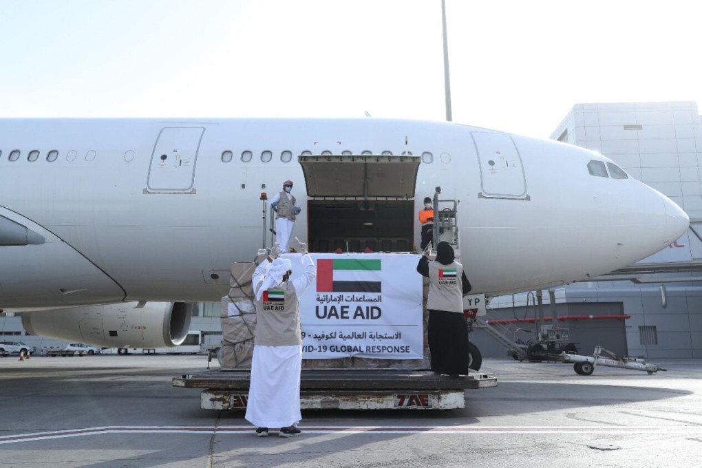An Etihad Airways flights loaded with aid for the Palestinians to fight the coronavirus pandemic is loaded in Abu Dhabi. Photo: WAM via AP