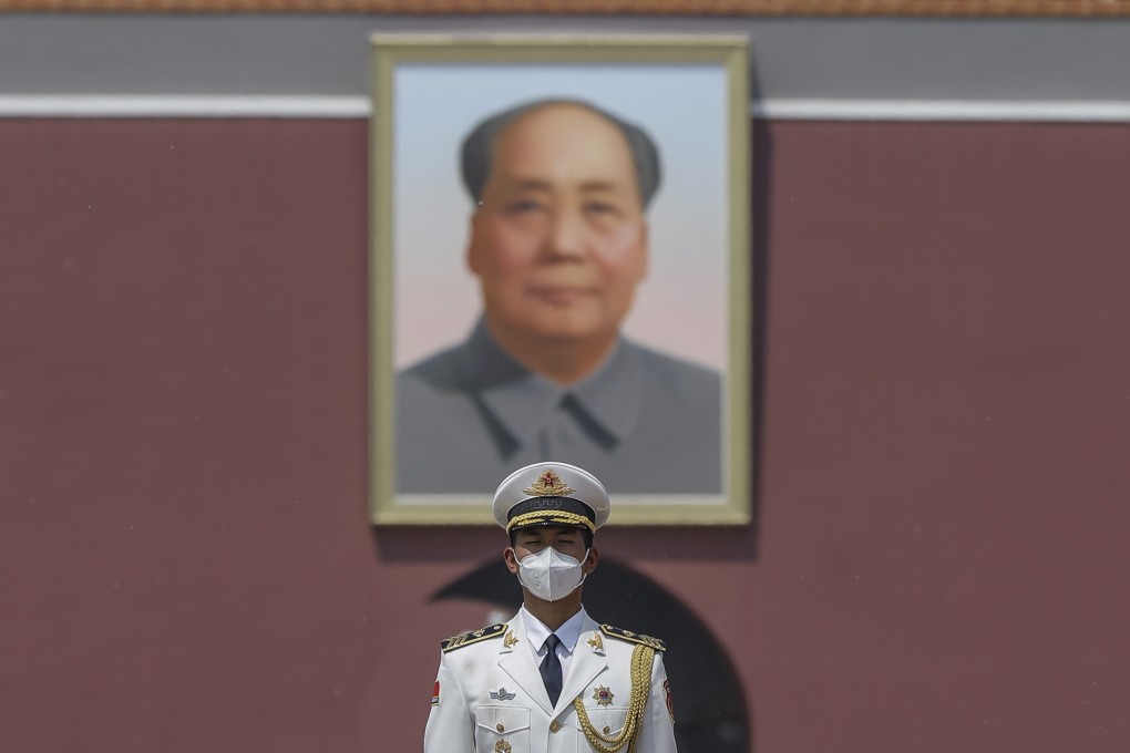 A paramilitary police officer stands guard in front of Mao Zedong’s portrait at Tiananmen Square in Beijing on April 28, as China emerges from the worst of the coronavirus pandemic. Photo: EPA-EFE