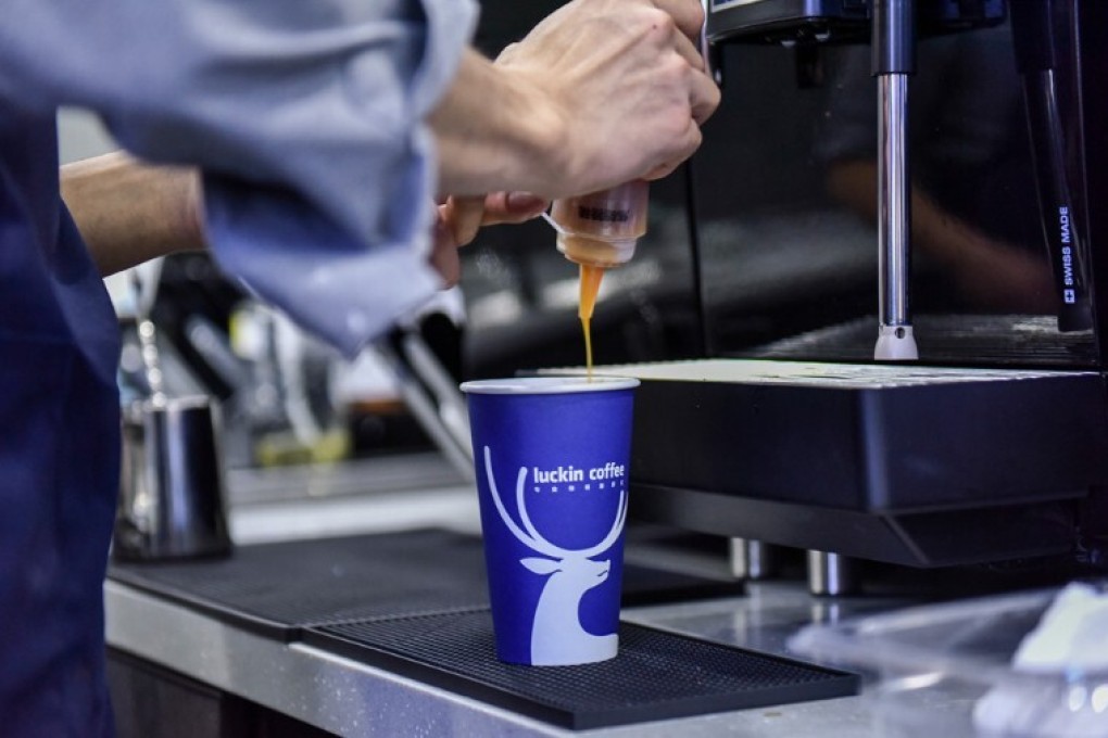 A server fills up a cup of Luckin Coffee in China. Photo: SCMP