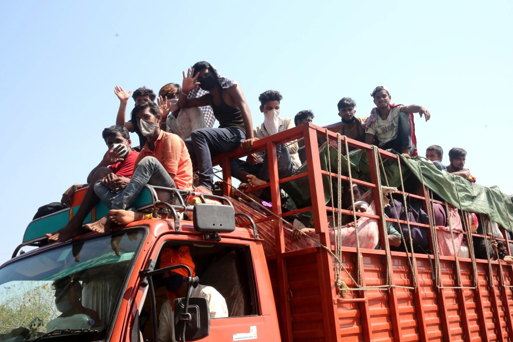 Migrant workers travel on a truck to return to their villages near Bhopal, Madhya Pradesh, on May 12, 2020. Photo: EPA-EFE
