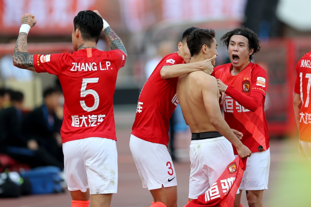 Guangzhou Evergrande celebrate becoming 2019 Chinese Super League champions. Players will not be allowed to hug under proposed 2020 rule changes. Photo: Xinhua