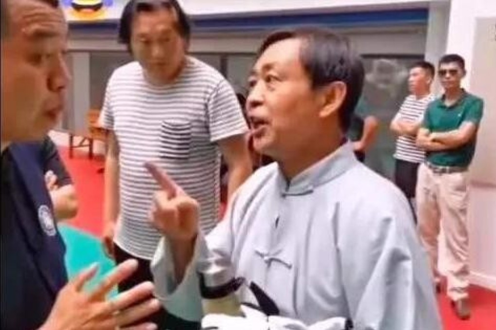 A still from the video of tai chi master Ma Baoguo (right) talking to the referee ahead of his embarrassing 30-second knockout. Photo: Hupu