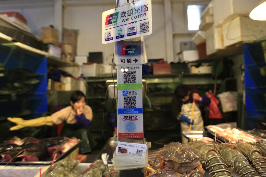 Alibaba’s Alipay and Tencent’s WeChat Pay are already popular payment methods in China. Photo: EPA