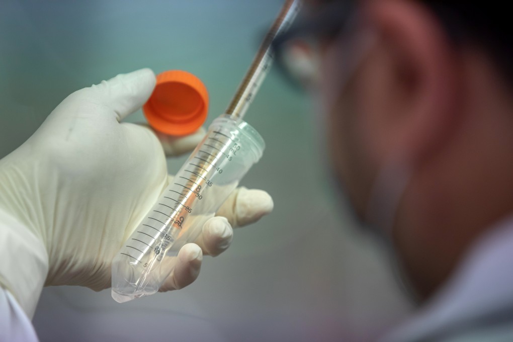 A technician cultivates lung cells as he preps for research into the infectivity of the SARS-CoV-2 in human lungs at a laboratory at the University of Hong Kong. Biotech IPOs are among the hottest stocks in Hong Kong this year amid public health crisis. Photo: Bloomberg