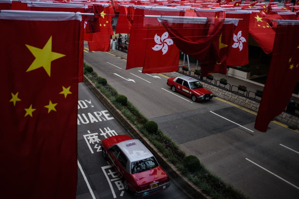 The national flag of China and the Hong Kong flag being flown in the city. Photo: AFP