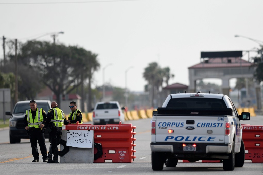 Police officers stand at a checkpoint after a shooting incident at Naval Air Station Corpus Christi in Texas on Thursday. Photo: USA Today Network via Reuters