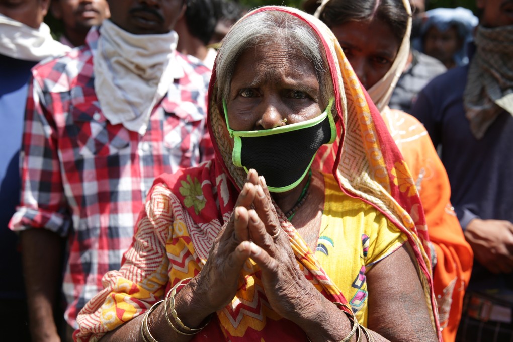 Family members of stranded migrant labourers from Bihar, in eastern India, plead with the authorities in Amritsar, in the northern state of Punjab, to make arrangements so they can get home, on May 18. Photo: EPA-EFE