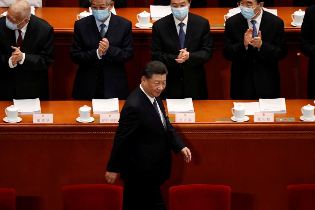 President Xi Jinping walks past officials at Friday’s opening session of the National People’s Congress in Beijing. Photo: Reuters