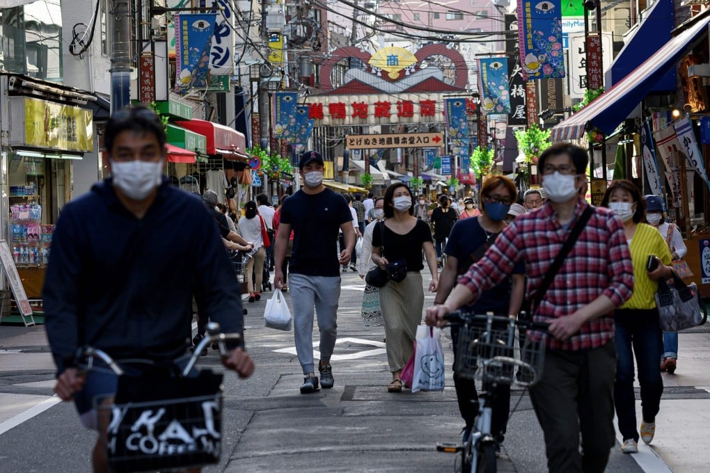 People wearing face masks in the Sugamo district of Tokyo. Photo: AFP