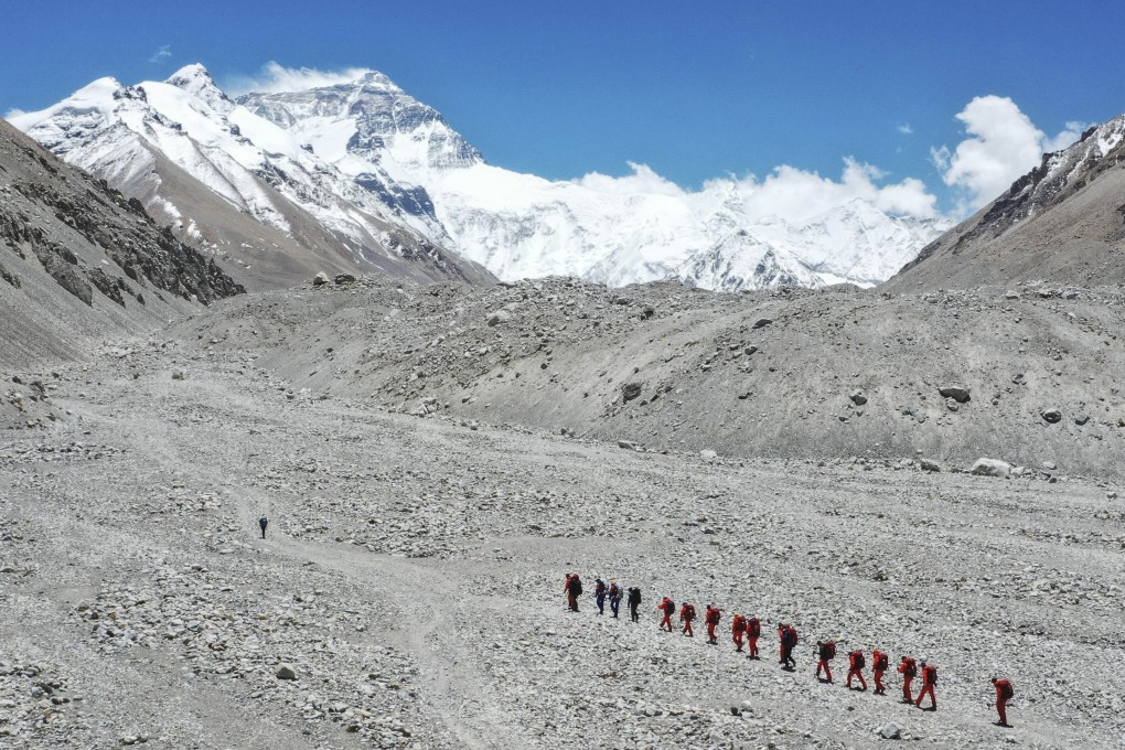 Chinese surveyors continue their ascent towards the summit of Mount Everest this month. Photo: AP