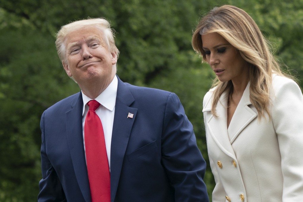 US President Donald Trump and First Lady Melania Trump walk on the South Lawn of the White House on Monday. Photo: Bloomberg