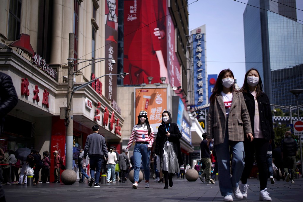 A shopping district in Shanghai. Local media says aggressive promotions by retailers have drawn thousands of buyers across the city. Photo: Reuters
