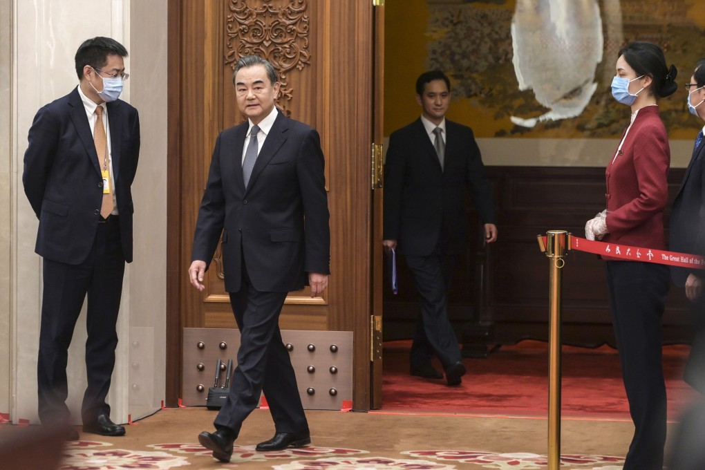 State Councillor and Foreign Minister Wang Yi arrives for a press conference on China’s foreign policy and foreign relations via video link, on the sidelines of the third session of the 13th National People’s Congress, at the Great Hall of the People in Beijing on May 24. Wang has defended the country’s combative “wolf warrior” diplomacy in combating “smears”. Photo: Xinhua